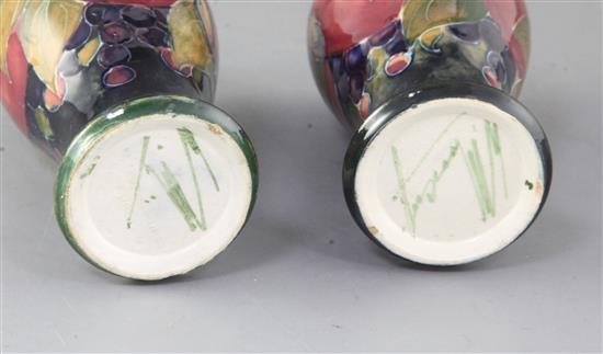 Two Moorcroft miniature pomegranate pattern baluster vases, height 10cm